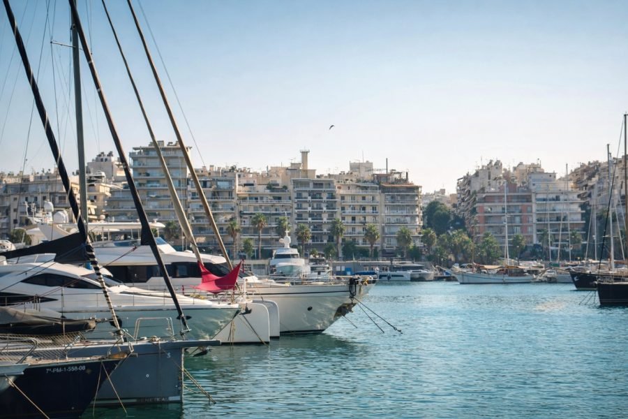 Zea Marina in Piraeus with yachts and waterfront buildings during a private maritime walking experience in Athens