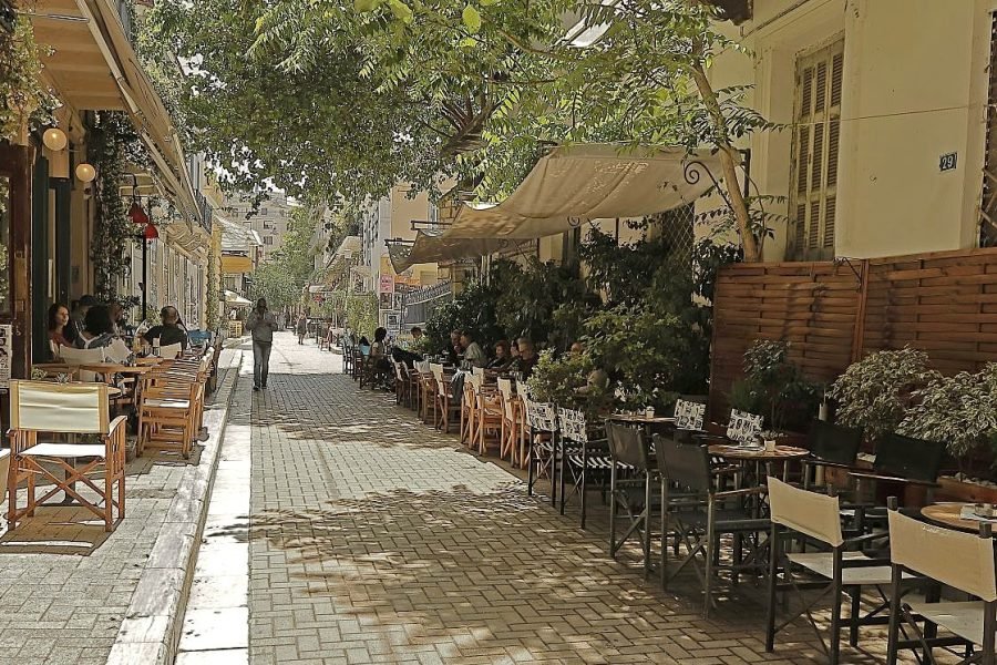 Outdoor dining street in Psiri, Athens, with local cafes and relaxed atmosphere