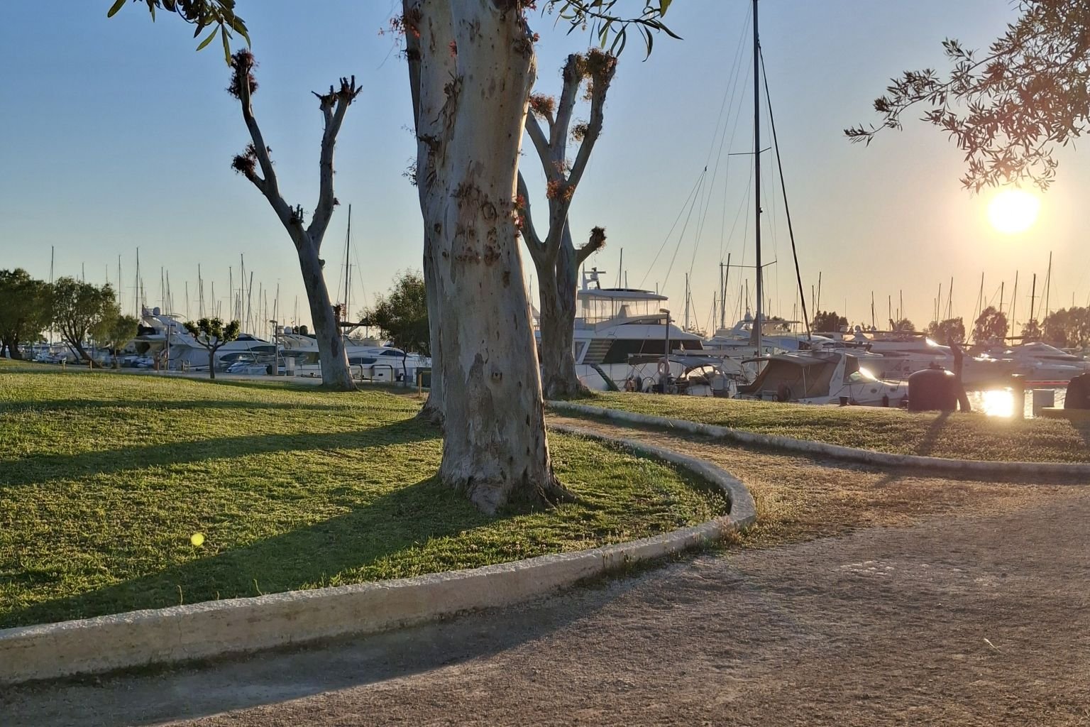 Sunset path near the Athens Riviera marina, reflecting a slower way to experience Athens.